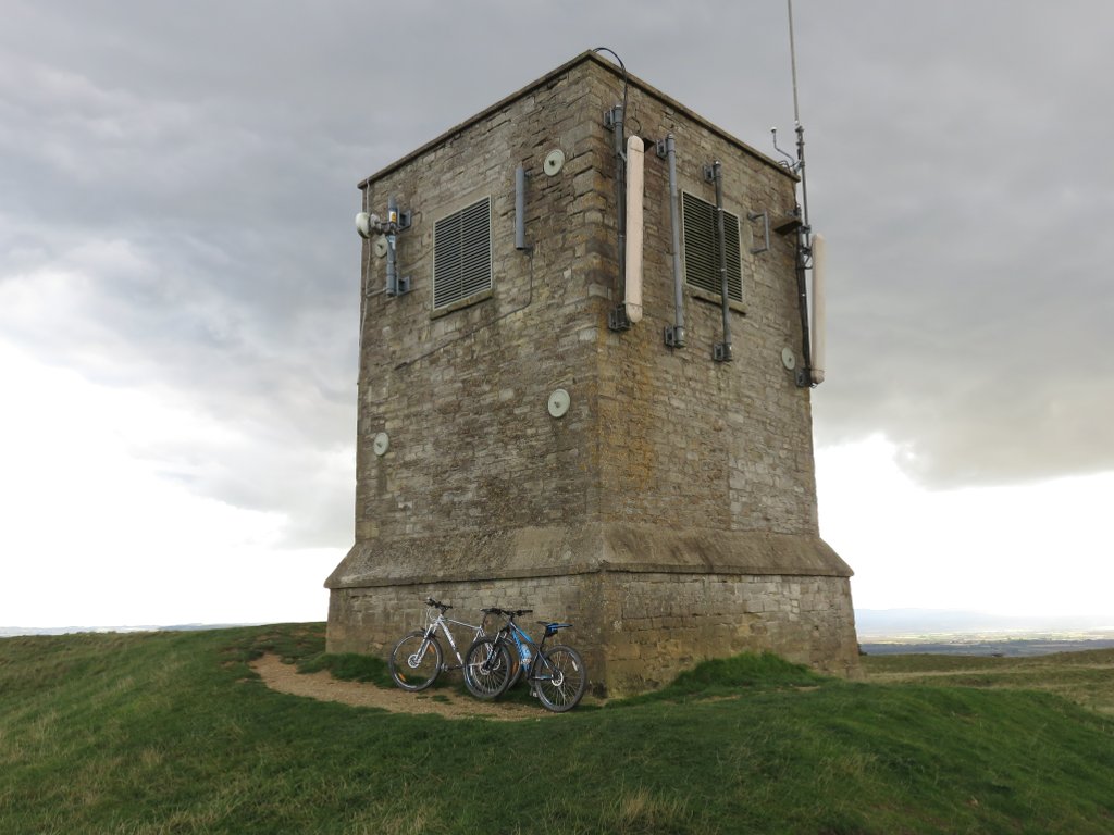bikes leaning against bredon hill stone tower