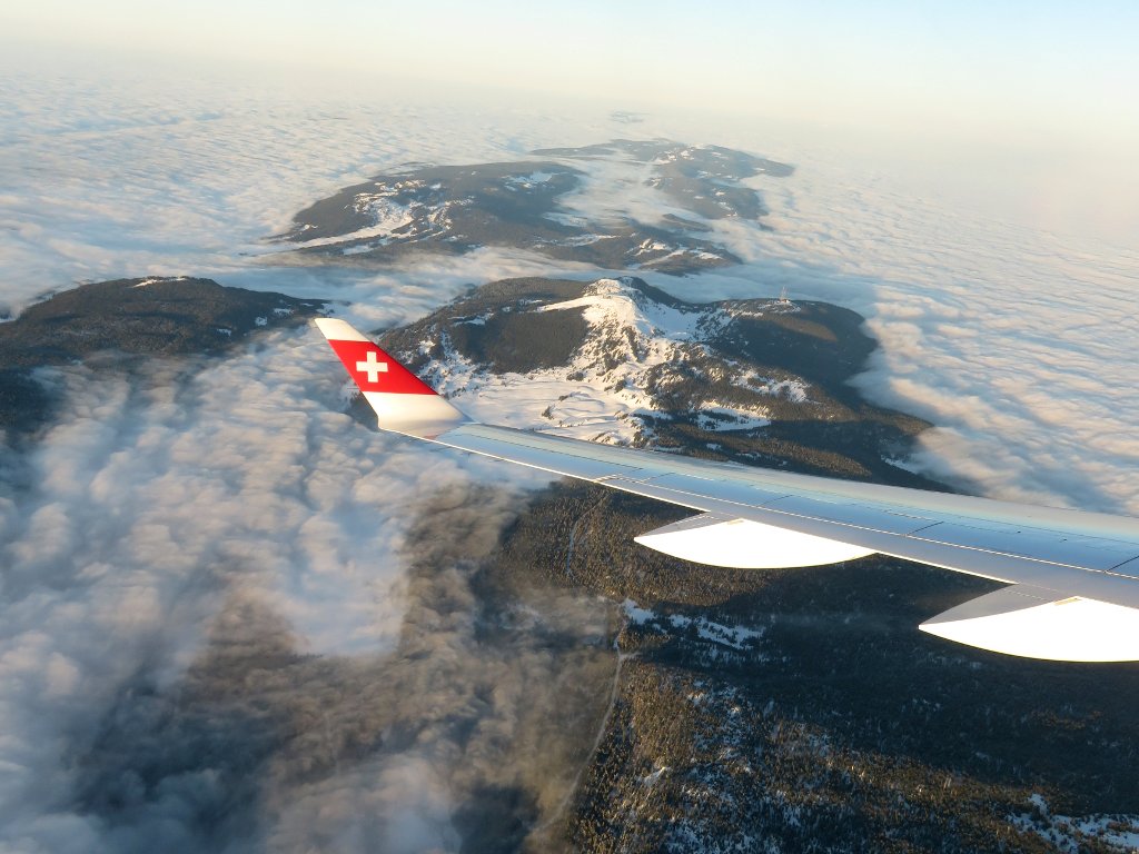 flying above the clouds coming into Geneva